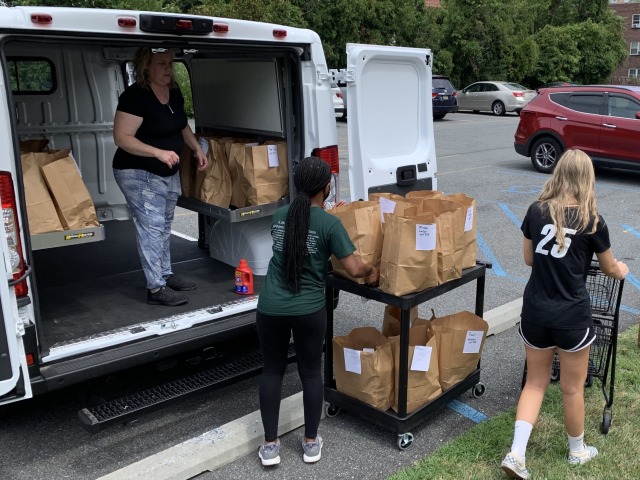 The van has fold-down shelving to hold lots of bags/boxes.